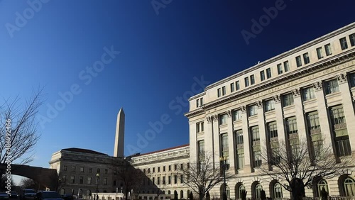 Panning shot of USDA headquarters, the U.S. Department of Agriculture Jamie L. Whitten Building in Washington, D.C. The camera pans from the Washington monument to the south-facing facade. photo