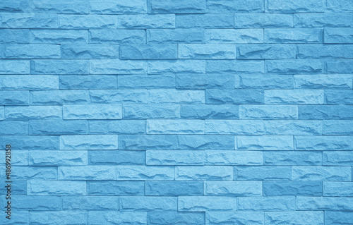 Brick wall painted with pale blue paint pastel calm tone texture background. 