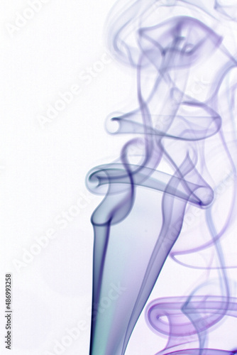 Real colorful smoke on white background. Graphic resource for use with blend modes. Fusion layers.