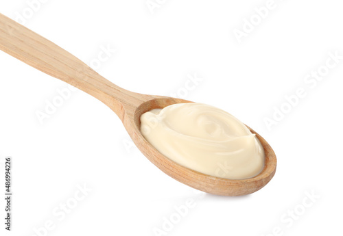 Wooden spoon with tasty mayonnaise isolated on white
