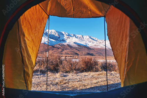 Tent lookout on a Camp in the mountains. view from tent camping entrance outdoor. Travel Lifestyle concept adventure vacations outdoor.