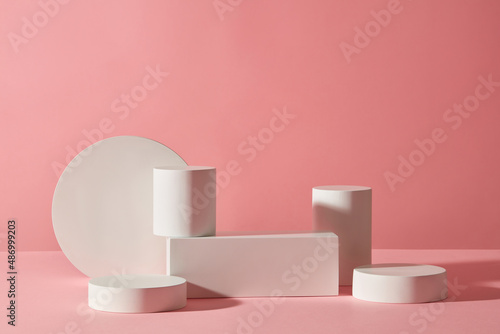 Abstract white podium in trendy pink background for advertising , front view 
