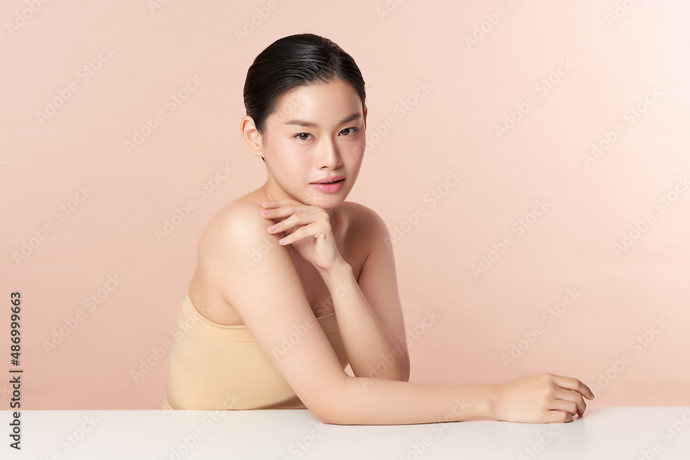 Beautiful young asian woman with clean fresh skin on beige background, Face care, Facial treatment, Cosmetology, beauty and spa, Asian women portrait. Beautiful young asian woman with clean fresh skin on beige background, Face care, Facial treatment, Cosmetology, beauty and spa, Asian women portrait.