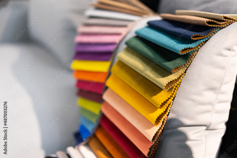 Tissue catalog. Catalog of multicolored fabric samples. Textile