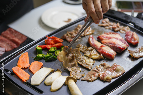 Korean beef barbecue a popular Korean dish with vegetables, green pepper, red pepper, carrot and masroon barbecue. 