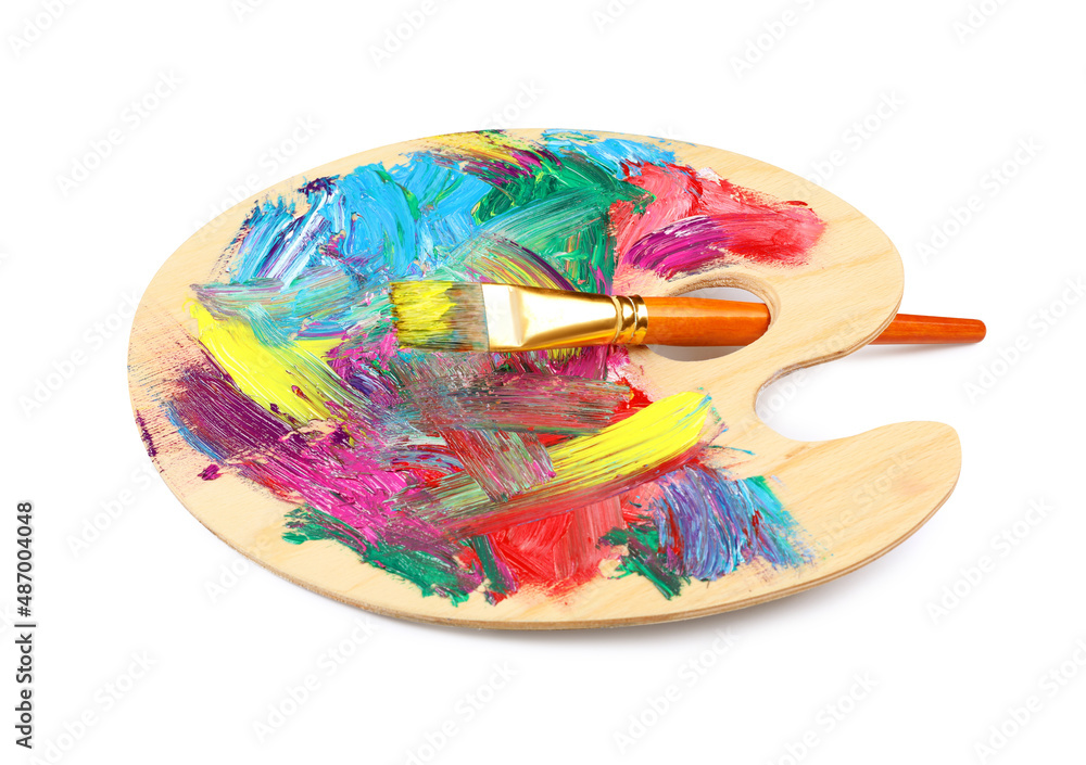 Wooden artist's palette with mixed paints and brush isolated on white Wooden artist's palette with mixed paints and brush isolated on white