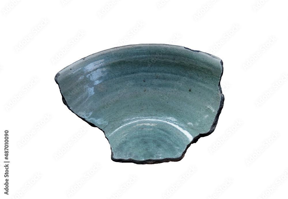 Cut out ancient sample of bowl-piece, coarse stoneware body with light green glazed on interior isolated on white background. Archaeology of ancient kiln sites in Lanna region, Ja-Manas kiln, Thailand Cut out ancient sample of bowl-piece, coarse stoneware body with light green glazed on interior isolated on white background. Archaeology of ancient kiln sites in Lanna region, Ja-Manas kiln, Thailand