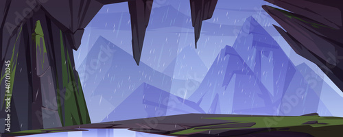 Cave or stone arch with view mountains in rain. Vector cartoon illustration of summer landscape of rocks, ledge, cavern entrance with moss and puddle, high cliffs and falling water drops