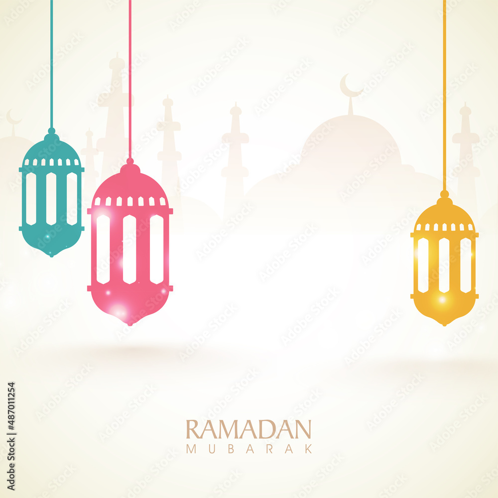 Fototapeta premium Colorful lanterns hanging on mosque silhouetted background for Muslim Community Festival, Ramadan Kareem celebration.