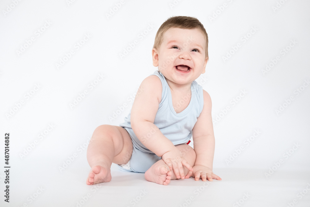 child baby boy sitting happy smiling boy on a white 7 month background child baby boy sitting happy smiling boy on a white 7 month background