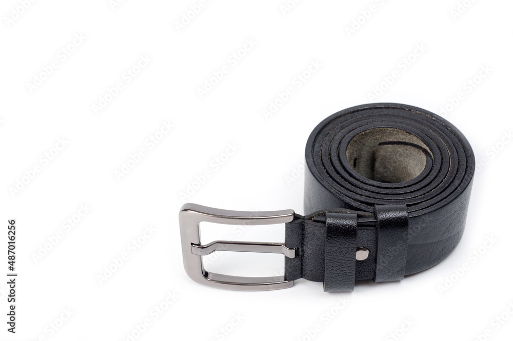 Black leather belt with a classic metal buckle for men's trousers and jeans. Black leather belt with a classic metal buckle for men's trousers and jeans.