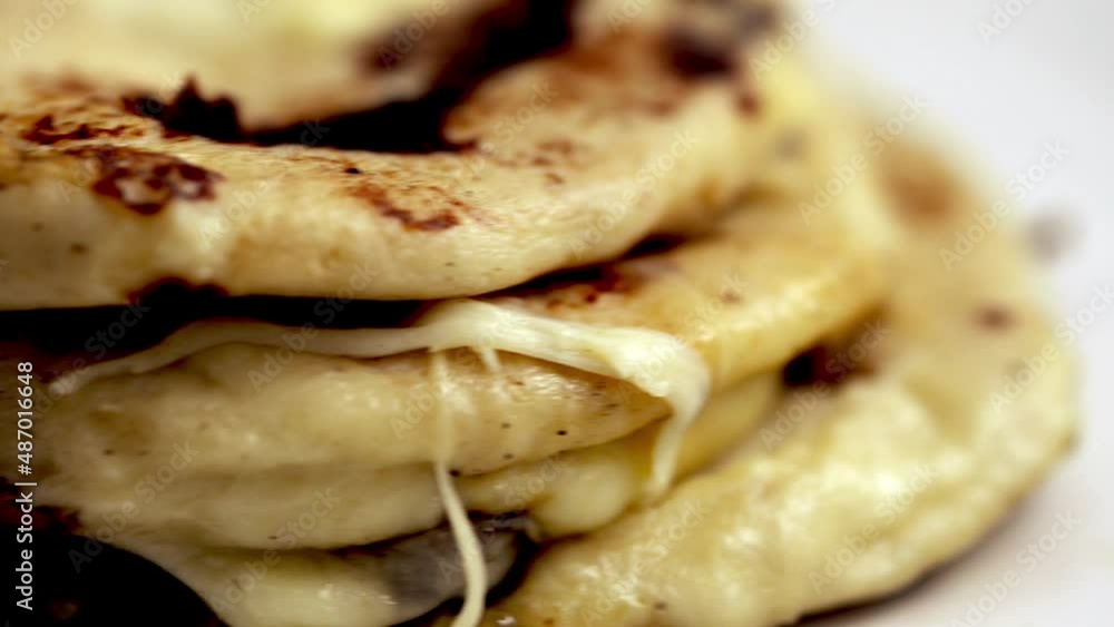 Close up video of Pupusas from El Salvador dish isolated on a stylish white plate Close up video of Pupusas from El Salvador dish isolated on a stylish white plate