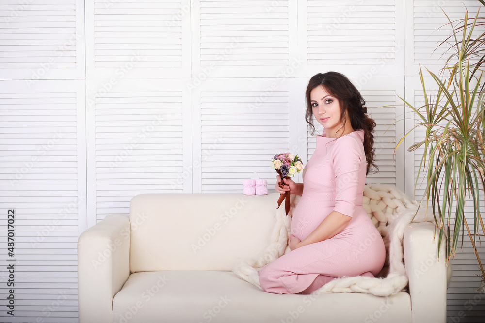 Beautiful pregnant girl with a big belly. Young married pregnant couple. Husband with a pregnant wife. A couple awaiting the birth of a baby. Beautiful pregnant girl with a big belly. Young married pregnant couple. Husband with a pregnant wife. A couple awaiting the birth of a baby.