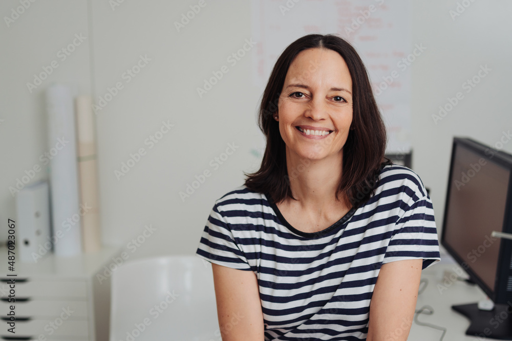 Happy miliddle-aged woman with a kovely warm smile Happy miliddle-aged woman with a kovely warm smile