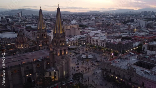 dusk flying counter clockwise around central plaza of Guadalajara Mexico photo