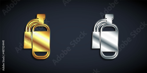 Gold and silver Fire extinguisher icon isolated on black background. Long shadow style. Vector