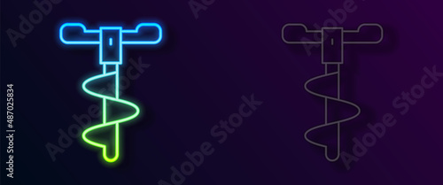Glowing neon line Hand ice drill for winter fishing icon isolated on black background. Vector