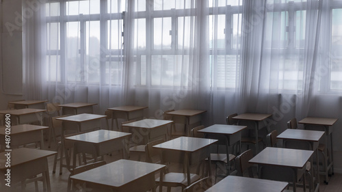 a empty classroom in the dark, natural light, school