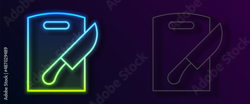Glowing neon line Cutting board and knife icon isolated on black background. Chopping Board symbol. Cutlery symbol. Vector