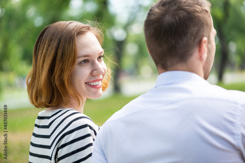 Young couple on a date in the park Young couple on a date in the park