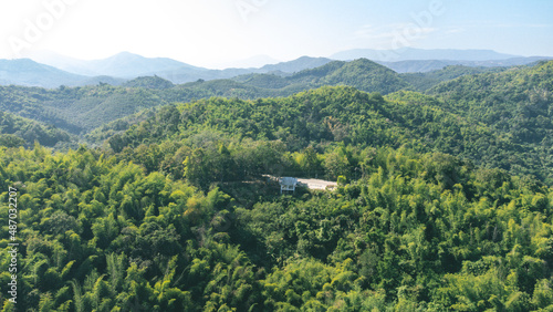 Area of Huai Krathing reservoir for Rafting and Eating at Loei Province, Thailand. Beautiful natural landscape of the river, mountain, blue sky with green forest and bamboo raft shelter.