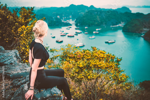 woman sitting on a rock