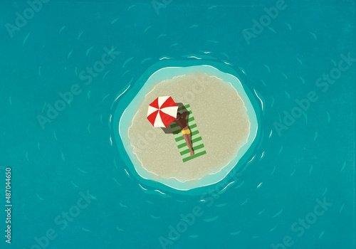 View from above man sunbathing on tiny island surrounded by water
 photo