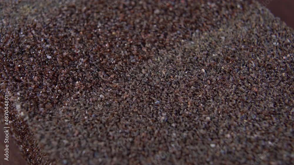 Sanding sponge block. Abrasive sandpaper rough texture. Macro. Rotation Sanding sponge block. Abrasive sandpaper rough texture. Macro. Rotation
