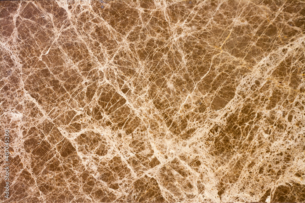 Marble background texture like cobweb with multiple strips and cracks. Brown marble tile. Horizontal photo. Marble background texture like cobweb with multiple strips and cracks. Brown marble tile. Horizontal photo.