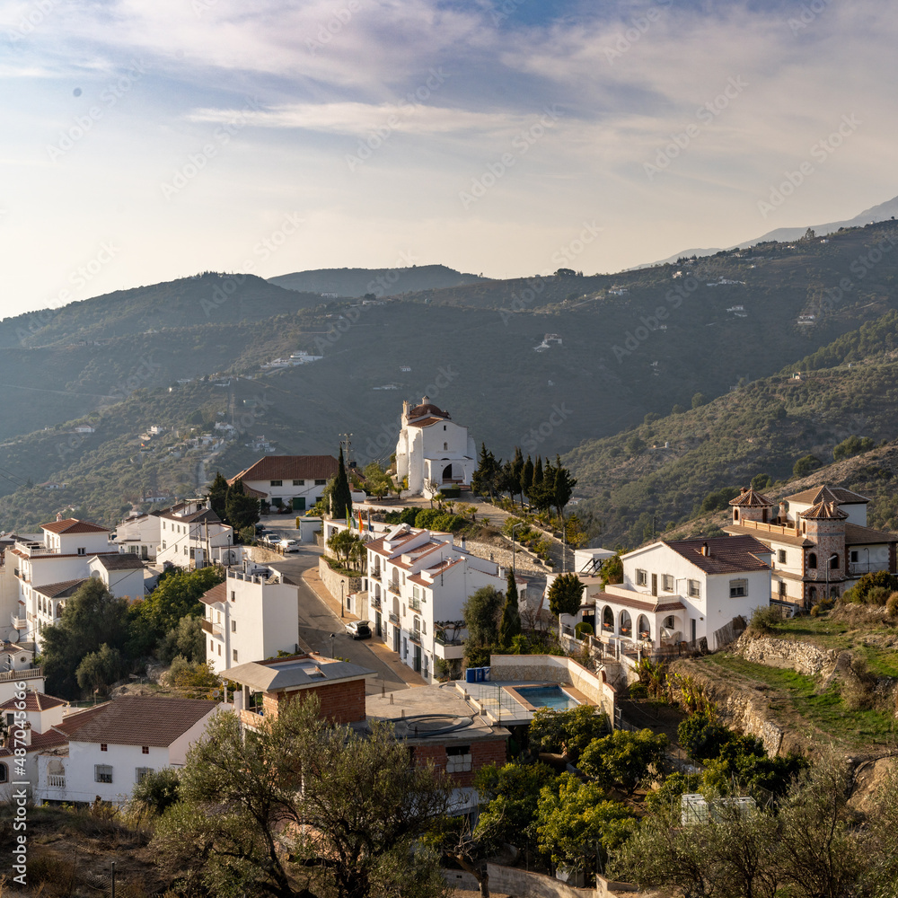 small village in the backcountry of Andalusia with whitewashed houses and a chapel on the hill