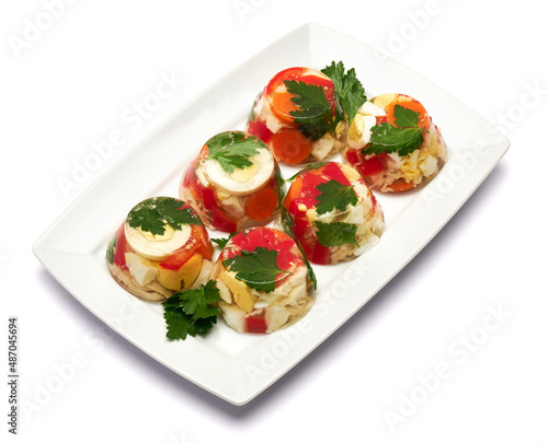 Portion of delicious chicken aspic on a plate isolated on white background