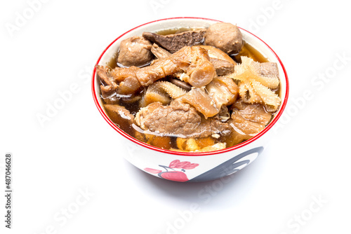 Soft stewed beef in a rich broth. Fragrant in a bowl. isolated on white background.