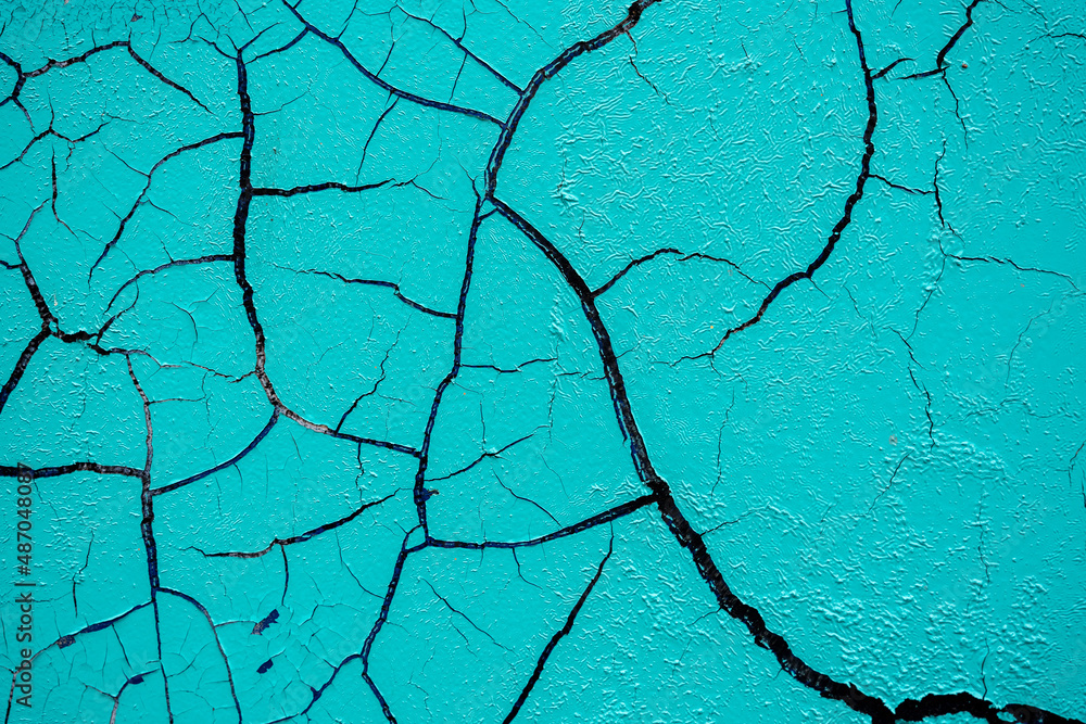 Cracked and damaged painted surface of a building or wall. Texture, aged paint background Cracked and damaged painted surface of a building or wall. Texture, aged paint background
