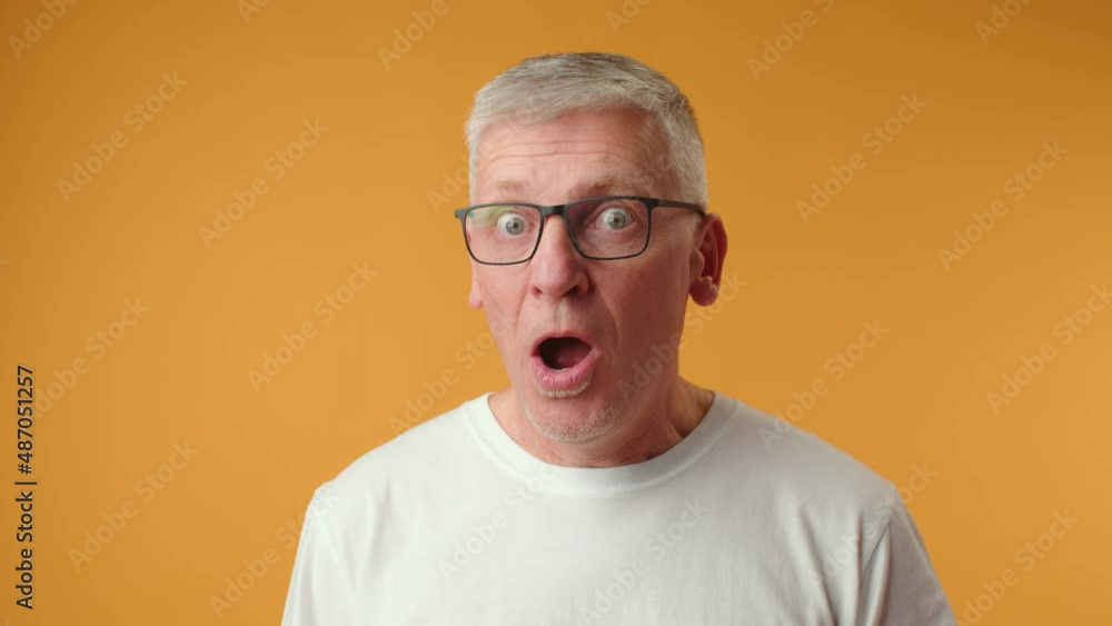 Handsome senior man wearing glasses afraid and shocked with surprise expression Handsome senior man wearing glasses afraid and shocked with surprise expression