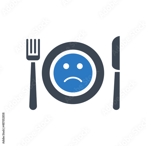 Loss of appetite related vector glyph icon. Cutlery, knife, fork and plate. On plate sad smiley. Loss of appetite sign. Isolated on white background. Editable vector illustration