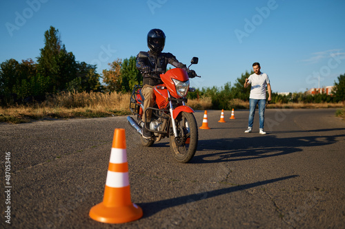 Student and instructor, exam in motorcycle school photo