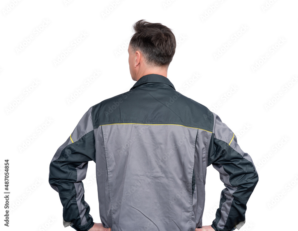 Fototapeta premium Confident male worker in uniform standing with his back to the camera isolated on white background 