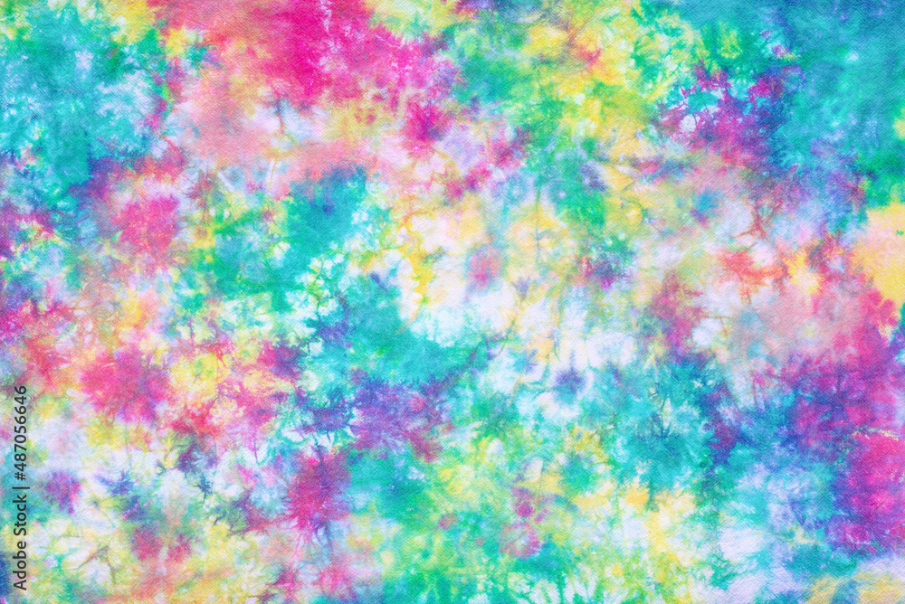 tie dye pattern hand dyed on cotton fabric background.