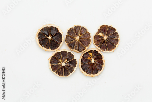dried lemon slices on a white background