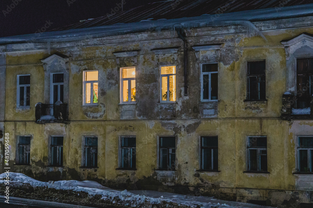 Old house, lights on in the windows, photos at night