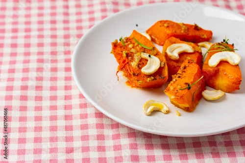 Fried baked pumpkin with spices, olive oil, herbs.