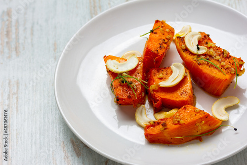 Fried baked pumpkin with spices, olive oil, herbs.
