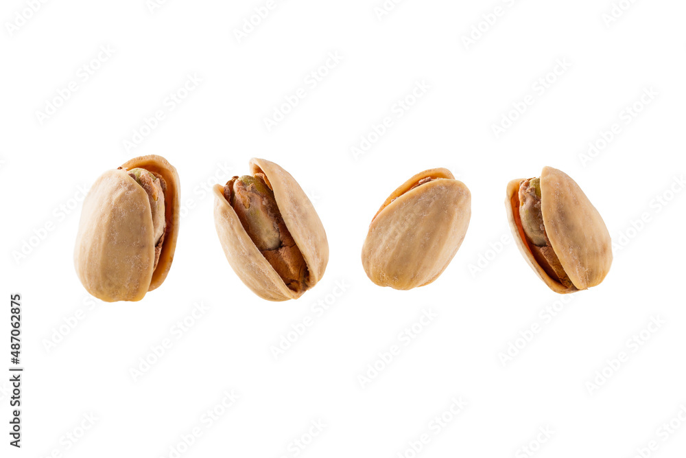Roasted pistachios isolated on white background for cutting out. Roasted pistachios isolated on white background for cutting out.