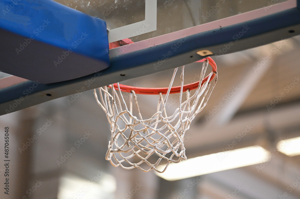Basketball hoop close up in old school sport gym hall