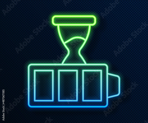 Glowing neon line Battery charge level indicator icon isolated on blue background. Vector
