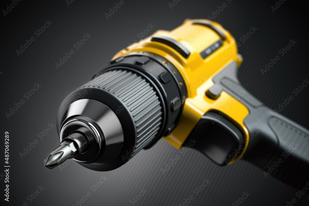 Yellow electric screwdriver drill close up background. Yellow electric screwdriver drill close up background.