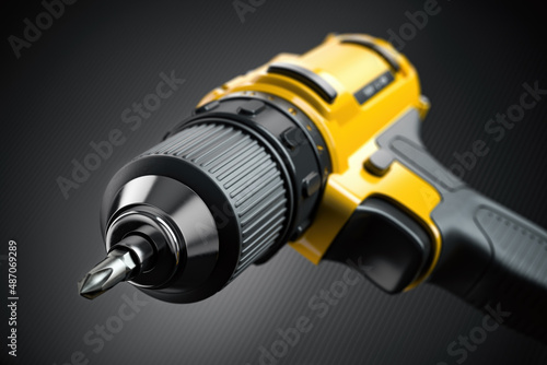 Yellow electric screwdriver drill  close up background. photo