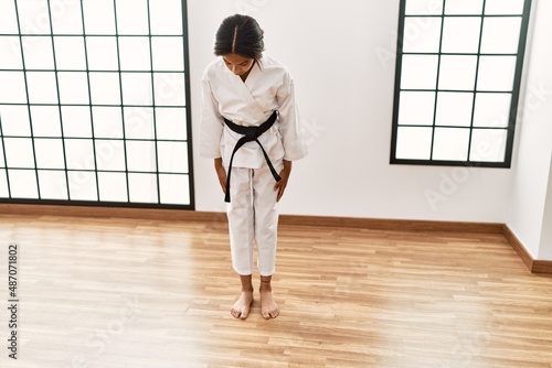 Canvas Print African american girl wearing kimono training karate at sport center