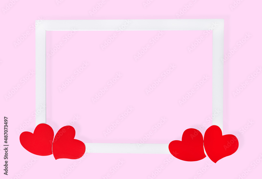 White frame with hearts on pink background