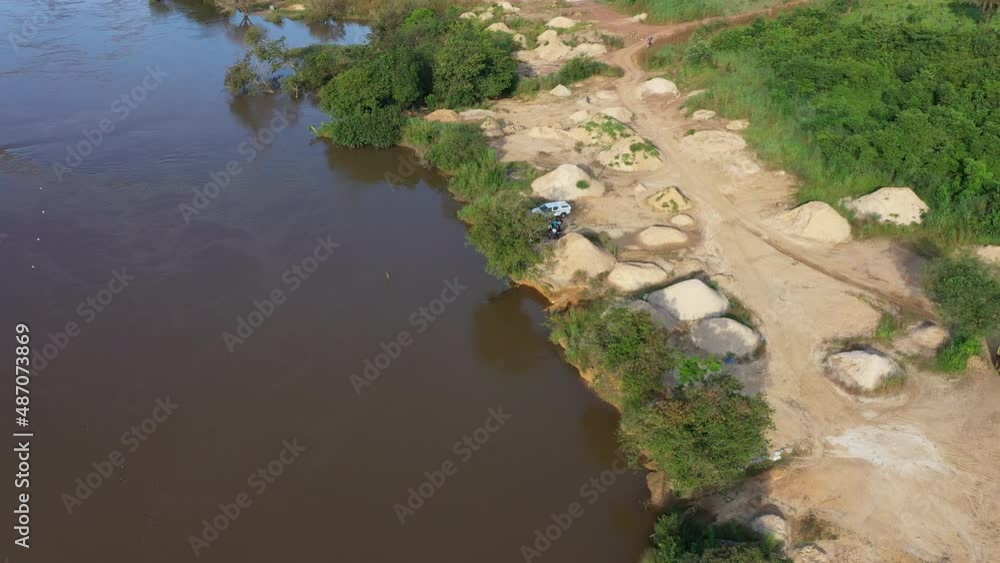 Aerial Sewa River diamond mining area Sierra Leone circle part 2. West Africa suffers extreme poverty and hunger. Forest jungle landscape environment. Congested crowded homes tropical climate. Aerial Sewa River diamond mining area Sierra Leone circle part 2. West Africa suffers extreme poverty and hunger. Forest jungle landscape environment. Congested crowded homes tropical climate.